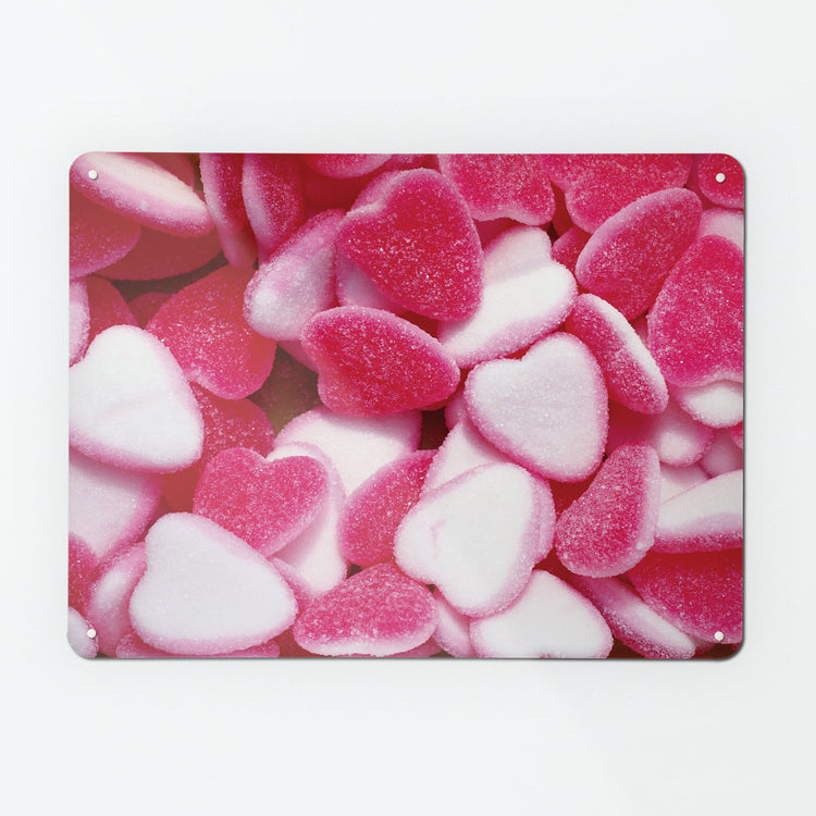 A large magnetic notice board by Beyond the Fridge with a photograph of pink heart sweets