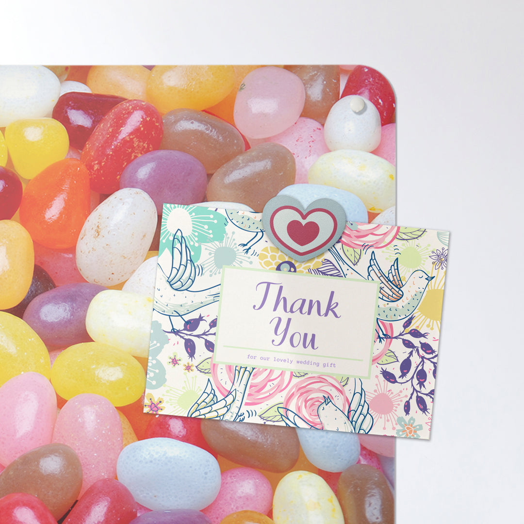A postcard on an jelly beans photographic magnetic board or metal wall art panel