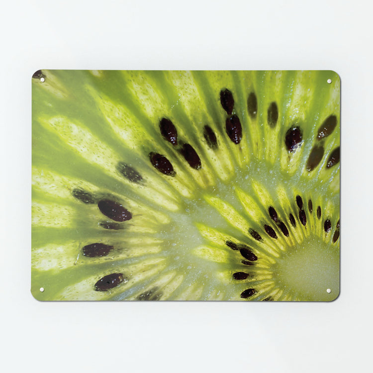 A large magnetic notice board by Beyond the Fridge with a close up photograph of a slice of kiwi fruit