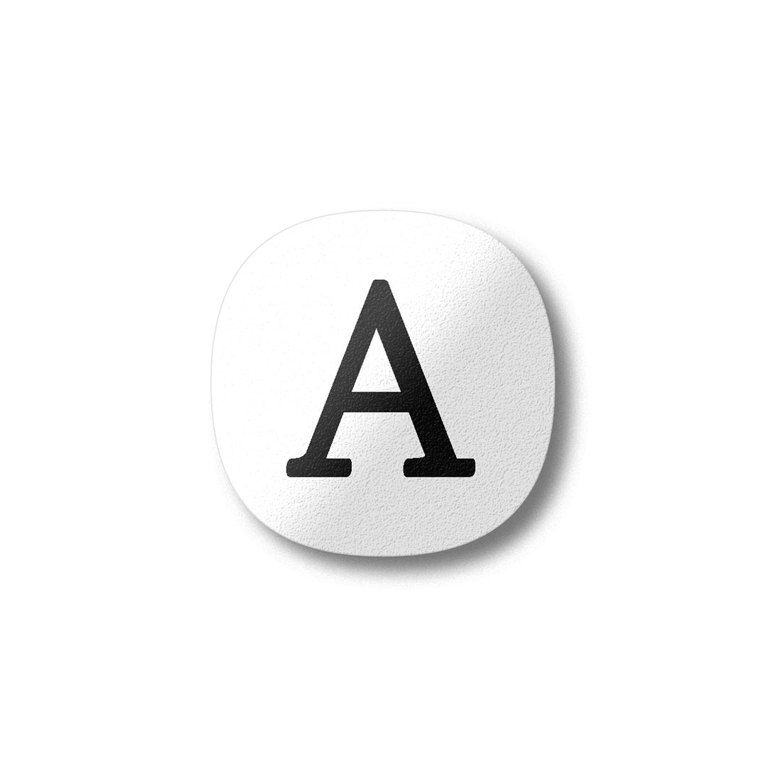 A white magnet with a black letter A plywood fridge magnet by Beyond the Fridge