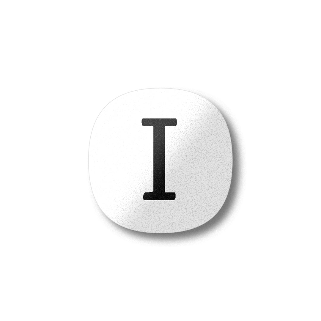 A white magnet with a black letter I plywood fridge magnet by Beyond the Fridge