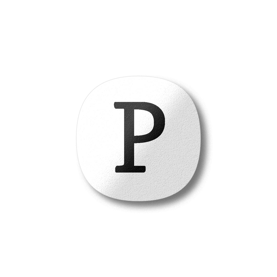A white magnet with a black letter P plywood fridge magnet by Beyond the Fridge