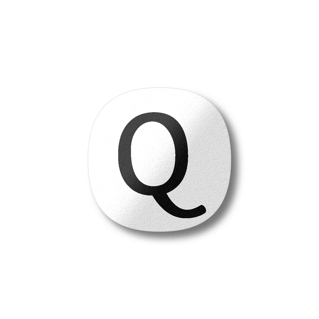 A white magnet with a black letter Q plywood fridge magnet by Beyond the Fridge