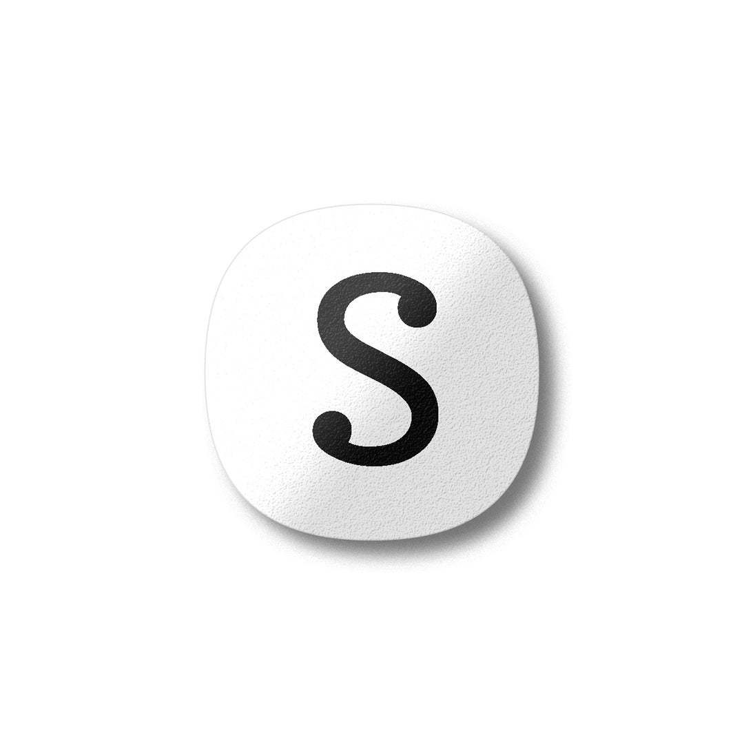 A white magnet with a black letter S plywood fridge magnet by Beyond the Fridge