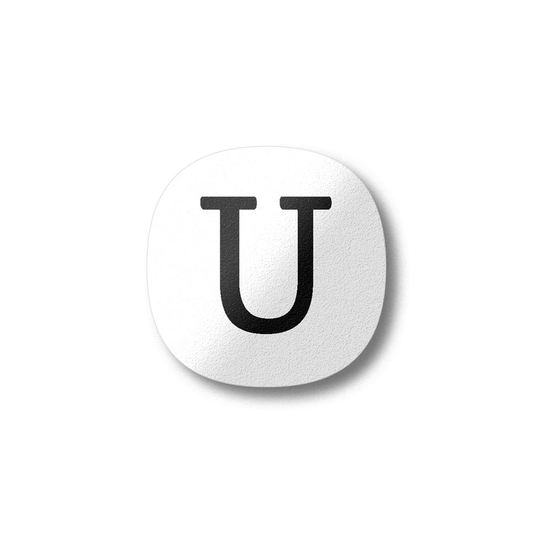 A white magnet with a black letter U plywood fridge magnet by Beyond the Fridge