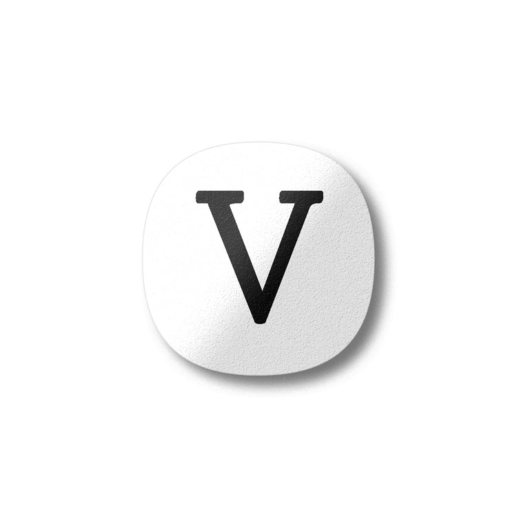 A white magnet with a black letter V plywood fridge magnet by Beyond the Fridge