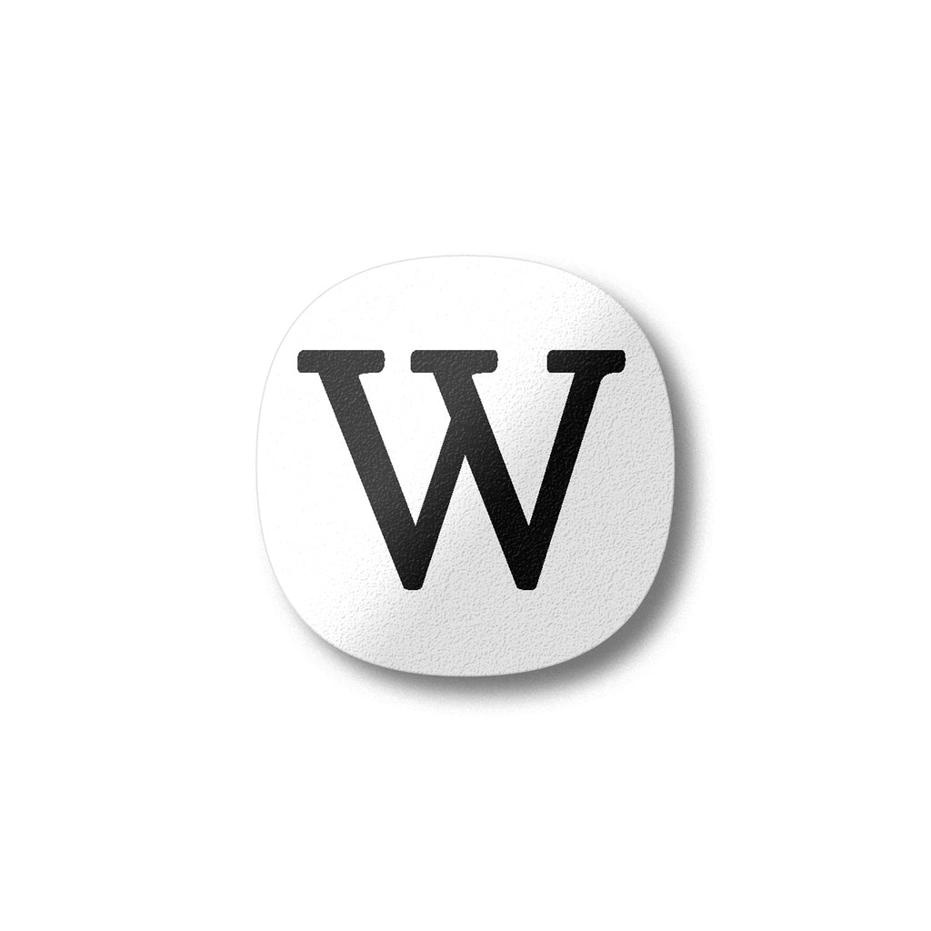 A white magnet with a black letter W plywood fridge magnet by Beyond the Fridge