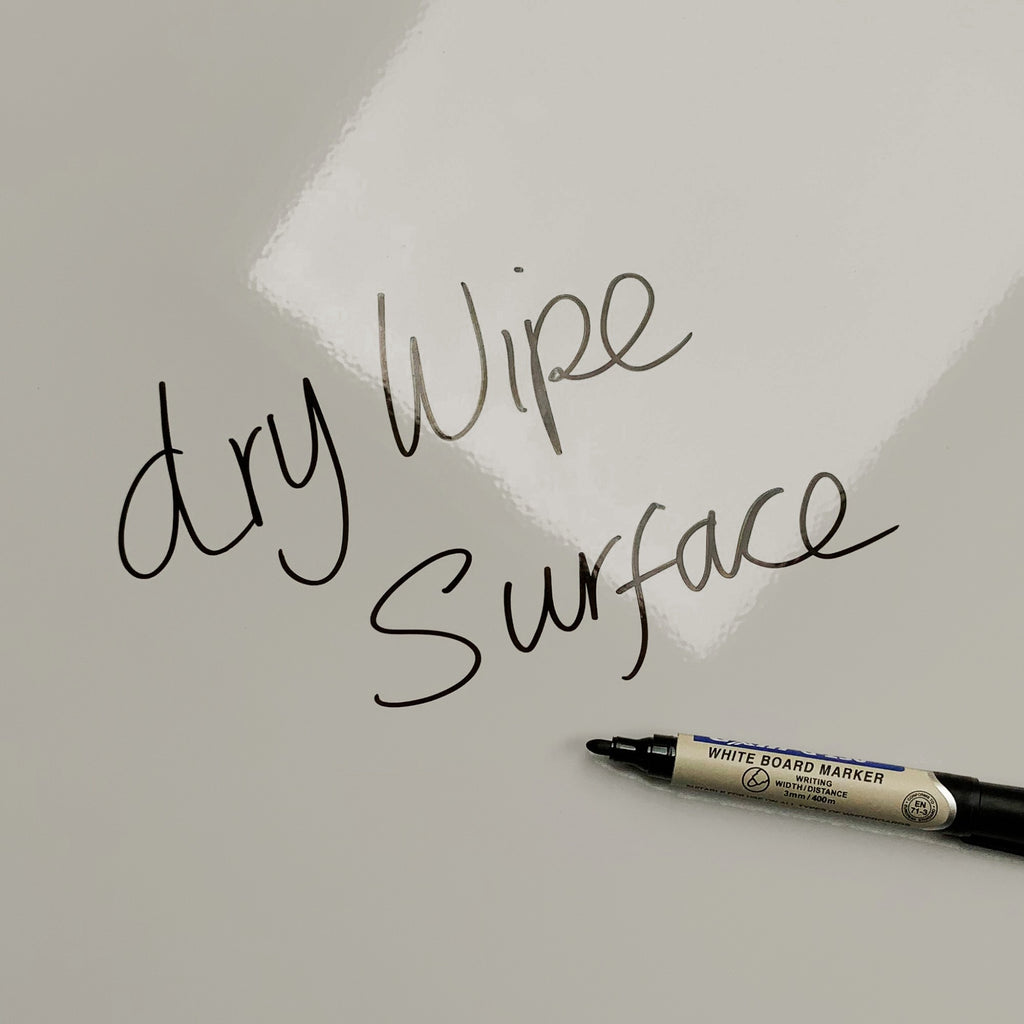 The words dry wipe surface written in marker pen on the Lilac magnetic notice board