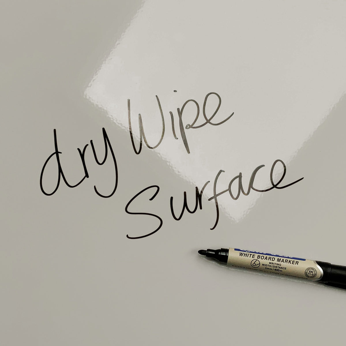 The words dry wipe surface written in marker pen on the Lilac magnetic notice board