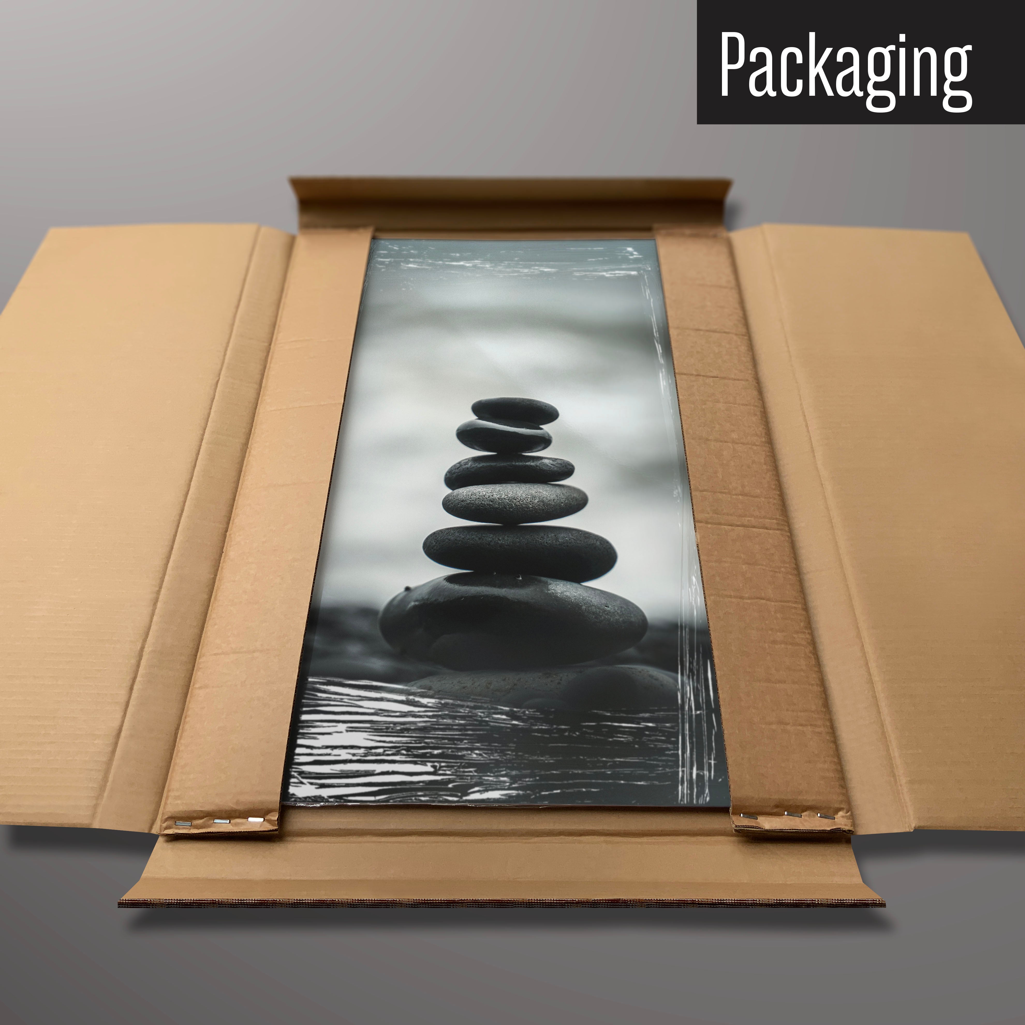 A balancing stones photographic magnetic board in it’s cardboard packaging