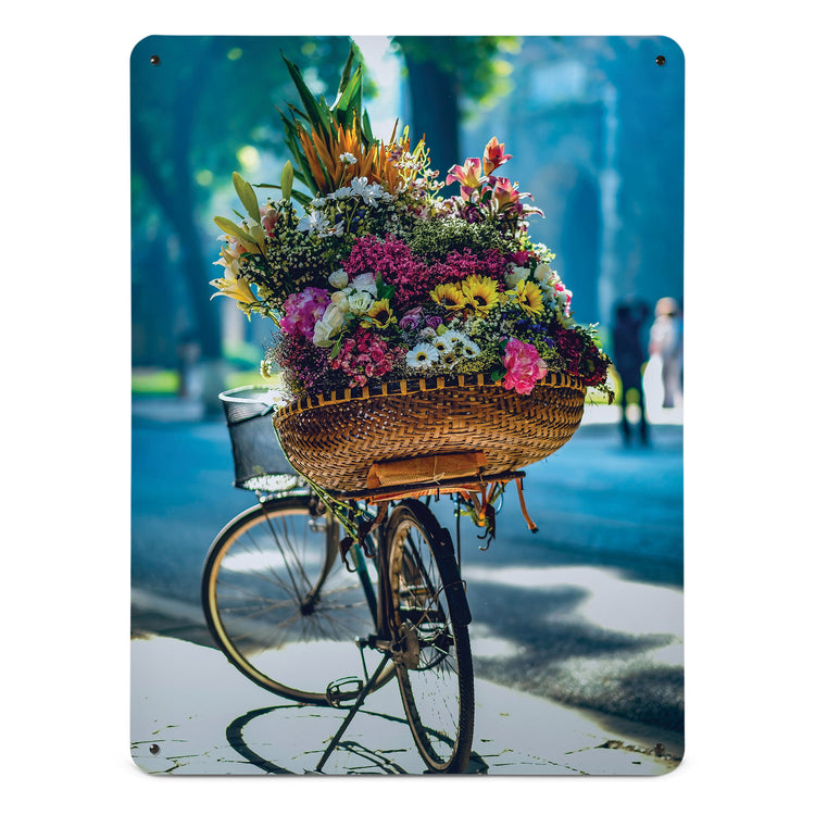 A large magnetic notice board by Beyond the Fridge with a photograph of a bicycle and a large basket of flowers