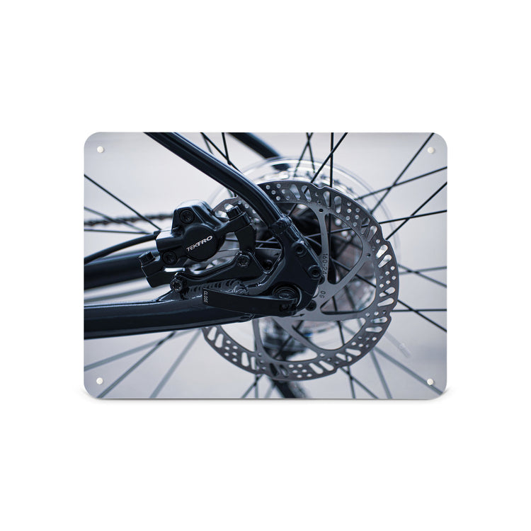 A medium magnetic notice board by Beyond the Fridge with a black and white photograph of bicycle spokes