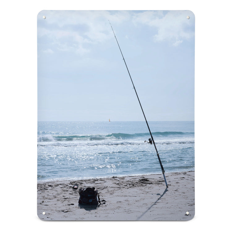 A large magnetic notice board by Beyond the Fridge with a photograph of fishing tackle on a sunny beach