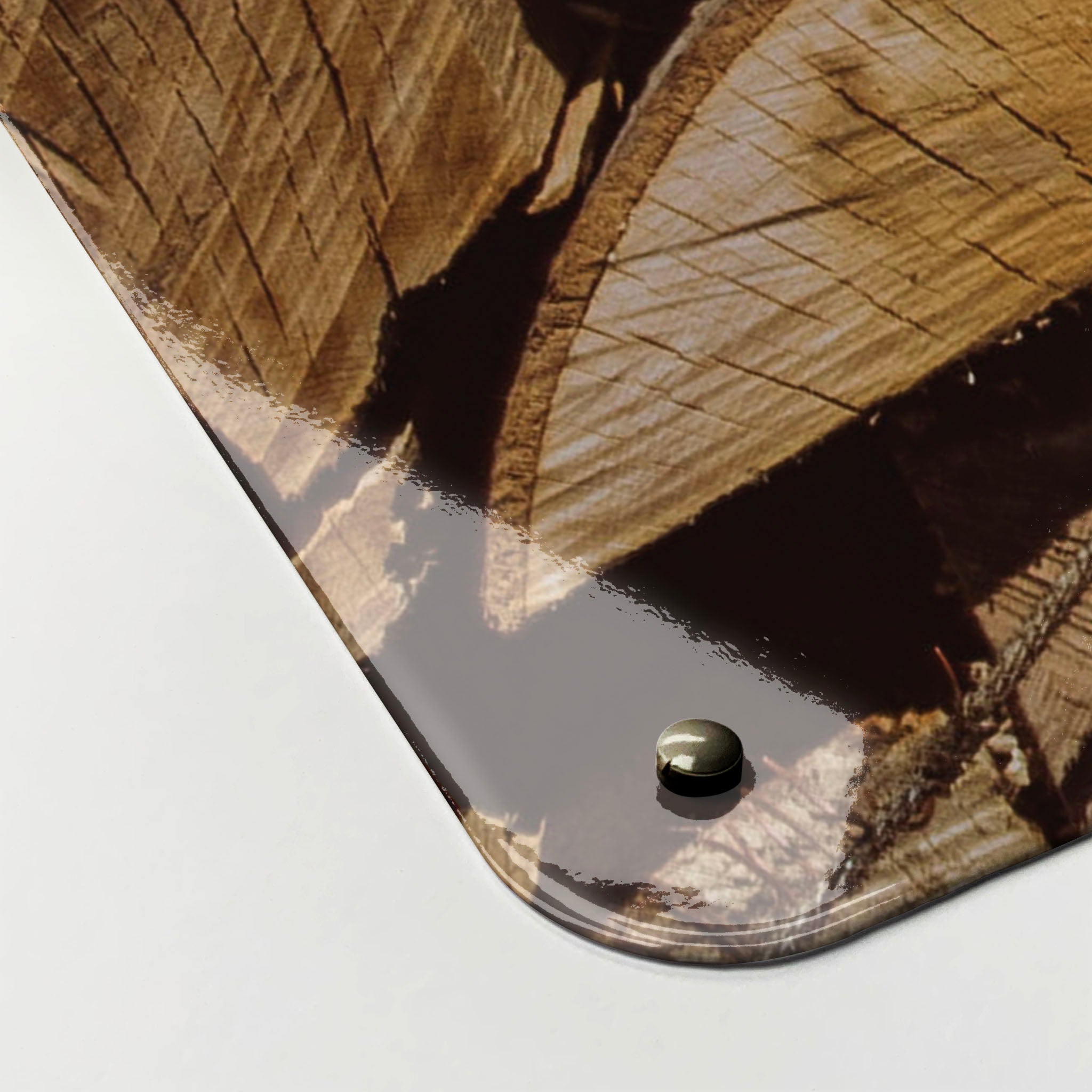 The corner detail of a log pile photographic magnetic board to show it’s high gloss surface