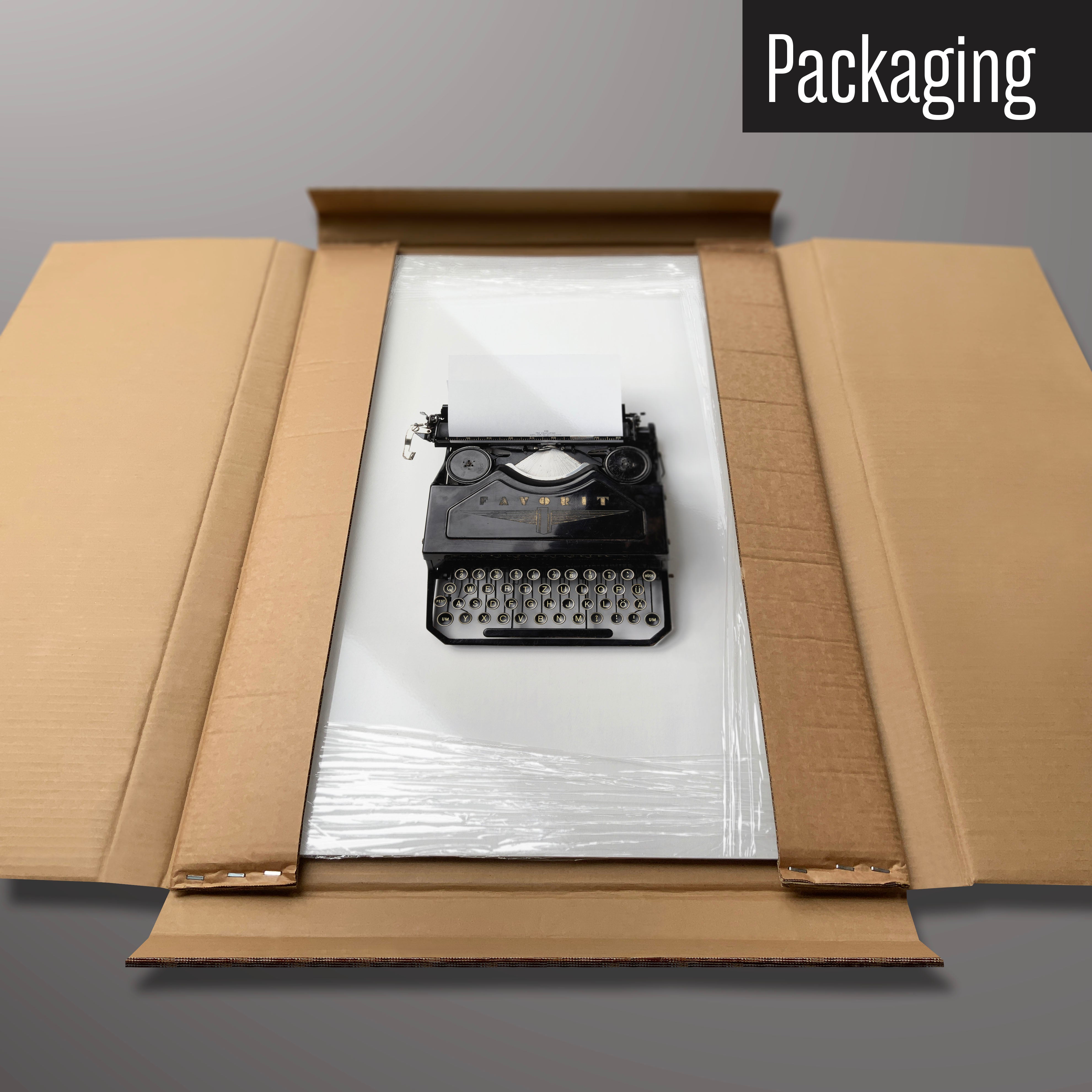 A vintage typewriter magnetic board in it’s cardboard packaging