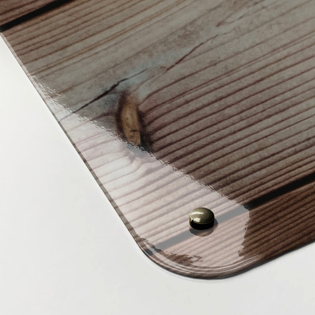 The corner detail of a wood cladding photographic magnetic board to show it’s high gloss surface