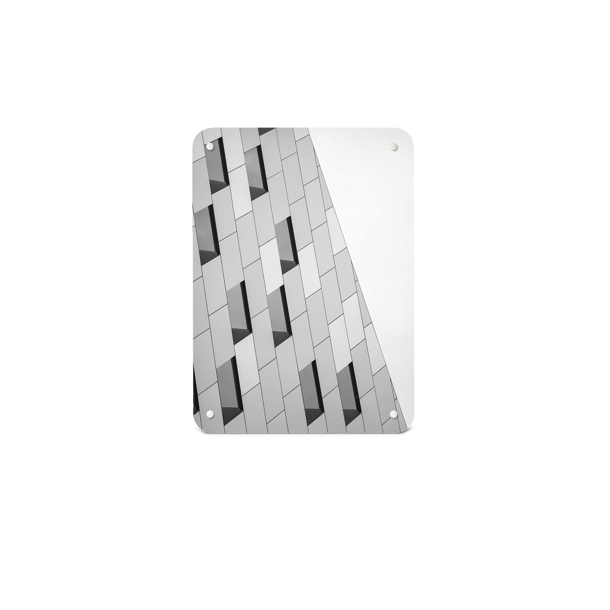 A small magnetic notice board by Beyond the Fridge with an image of an abstract building and windows in black and white 
