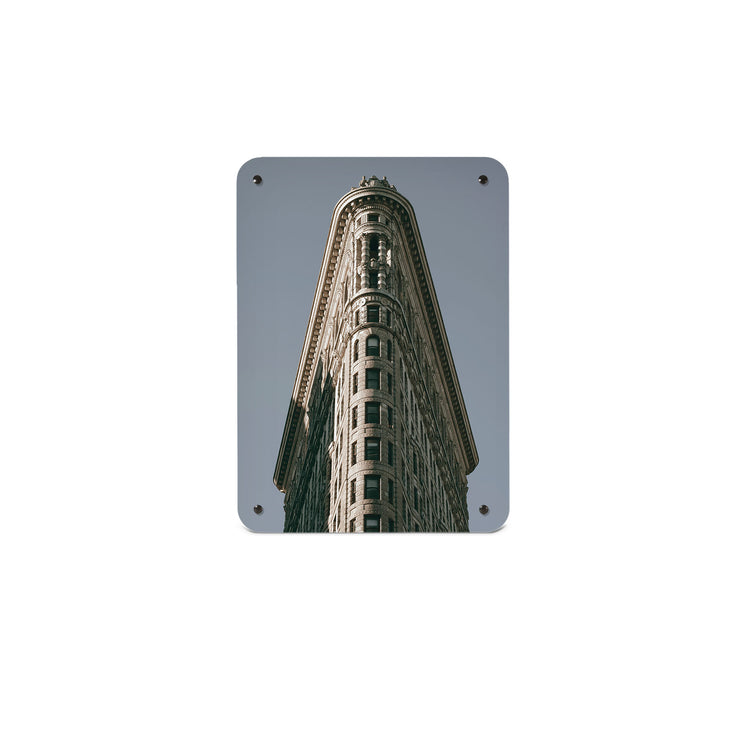 A small magnetic notice board by Beyond the Fridge with an image of the flatiron building in Manhattan 