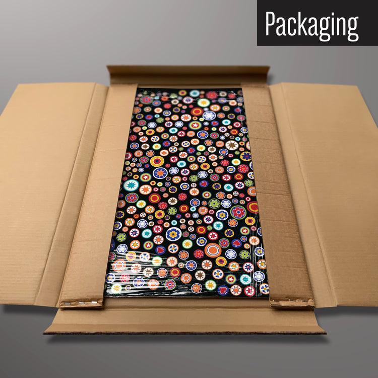 A millefiori on black design magnetic board in it’s cardboard packaging