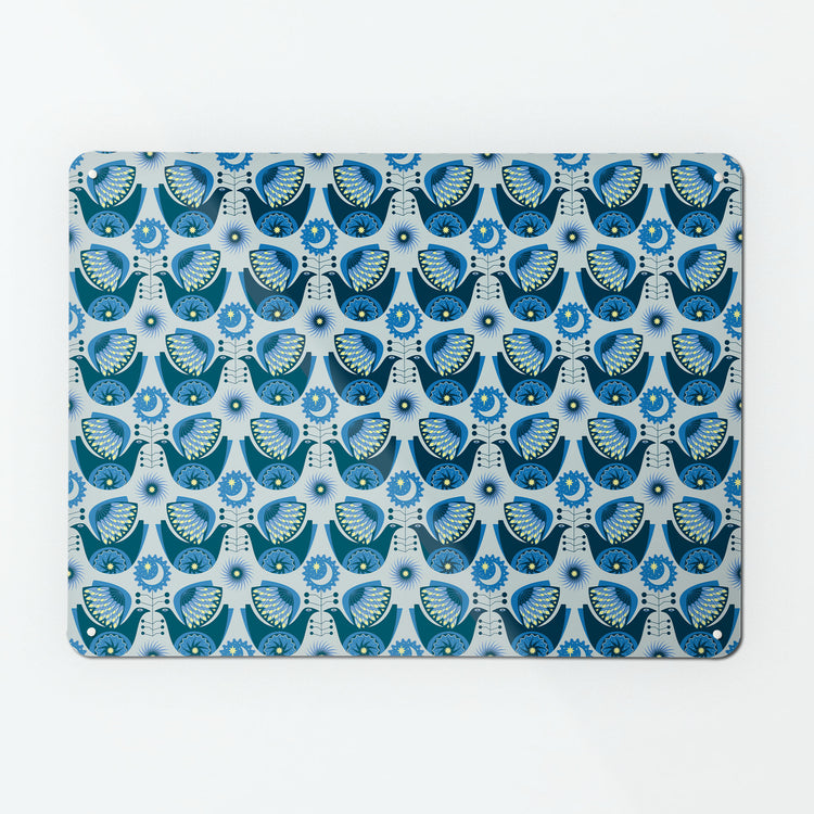 A large magnetic notice board by Beyond the Fridge with a retro style repeat pattern design of night birds in blue colours