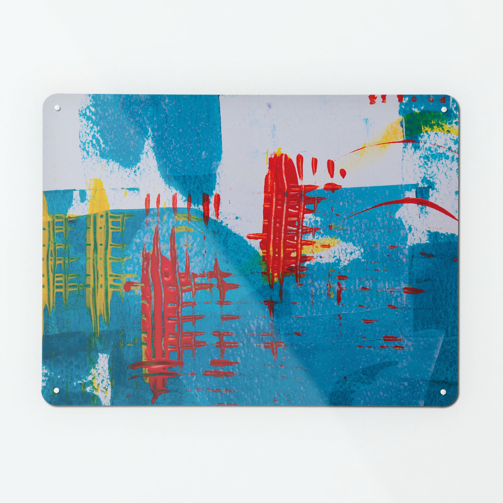 A large magnetic notice board by Beyond the Fridge with an image of an abstract painting titled Out of the Blue in blue, white, red and yellow