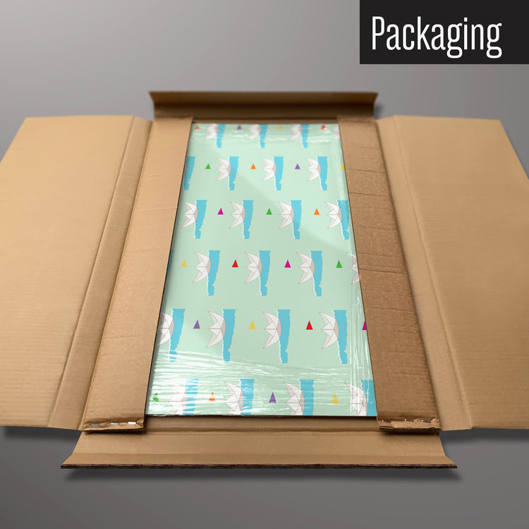 A paper boats design magnetic board in it’s cardboard packaging