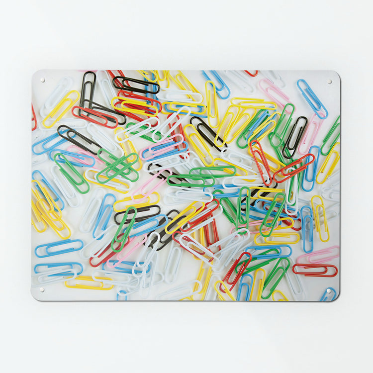 A large magnetic notice board by Beyond the Fridge with a photograph of multi coloured paper clips