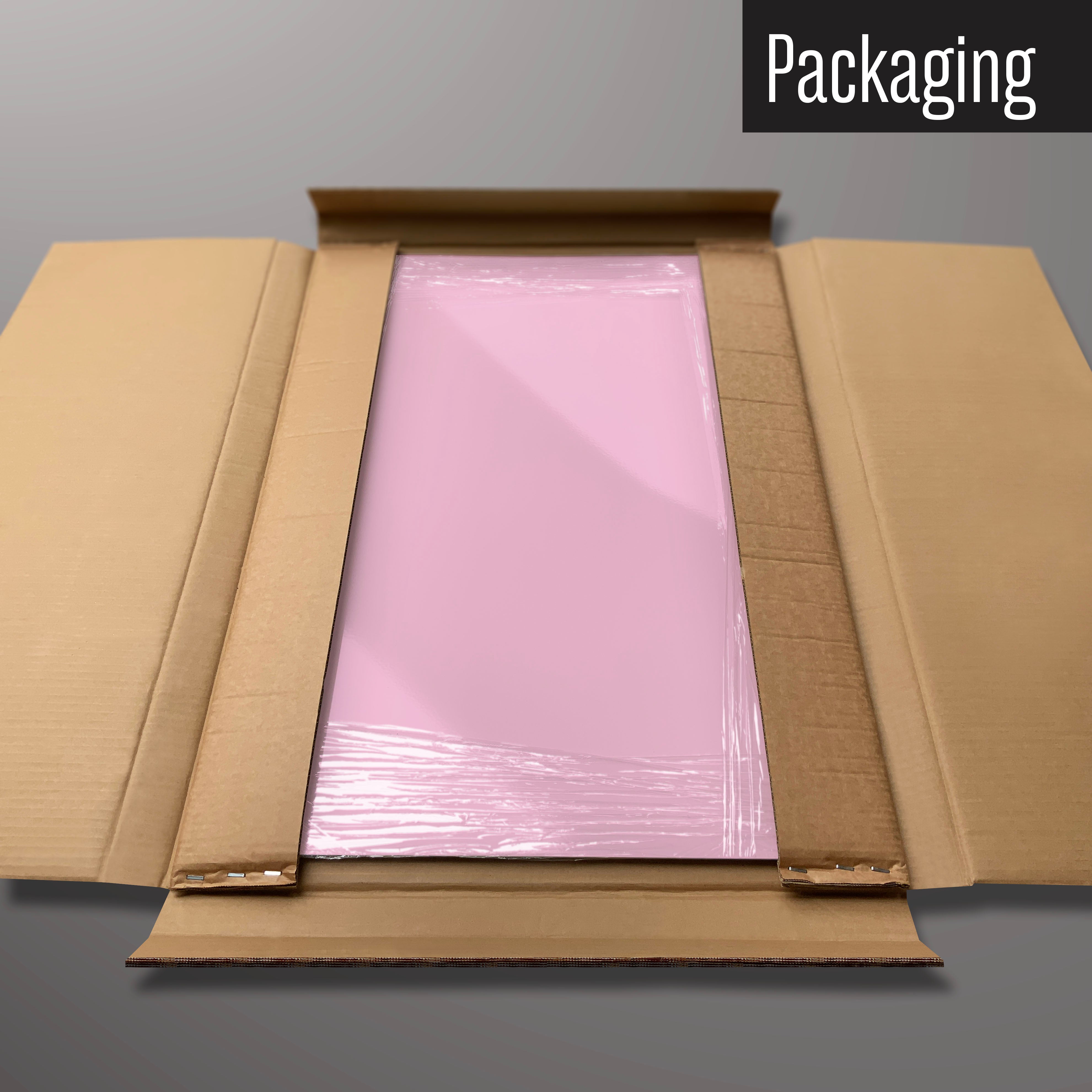 A plain pink magnetic board in it’s cardboard packaging