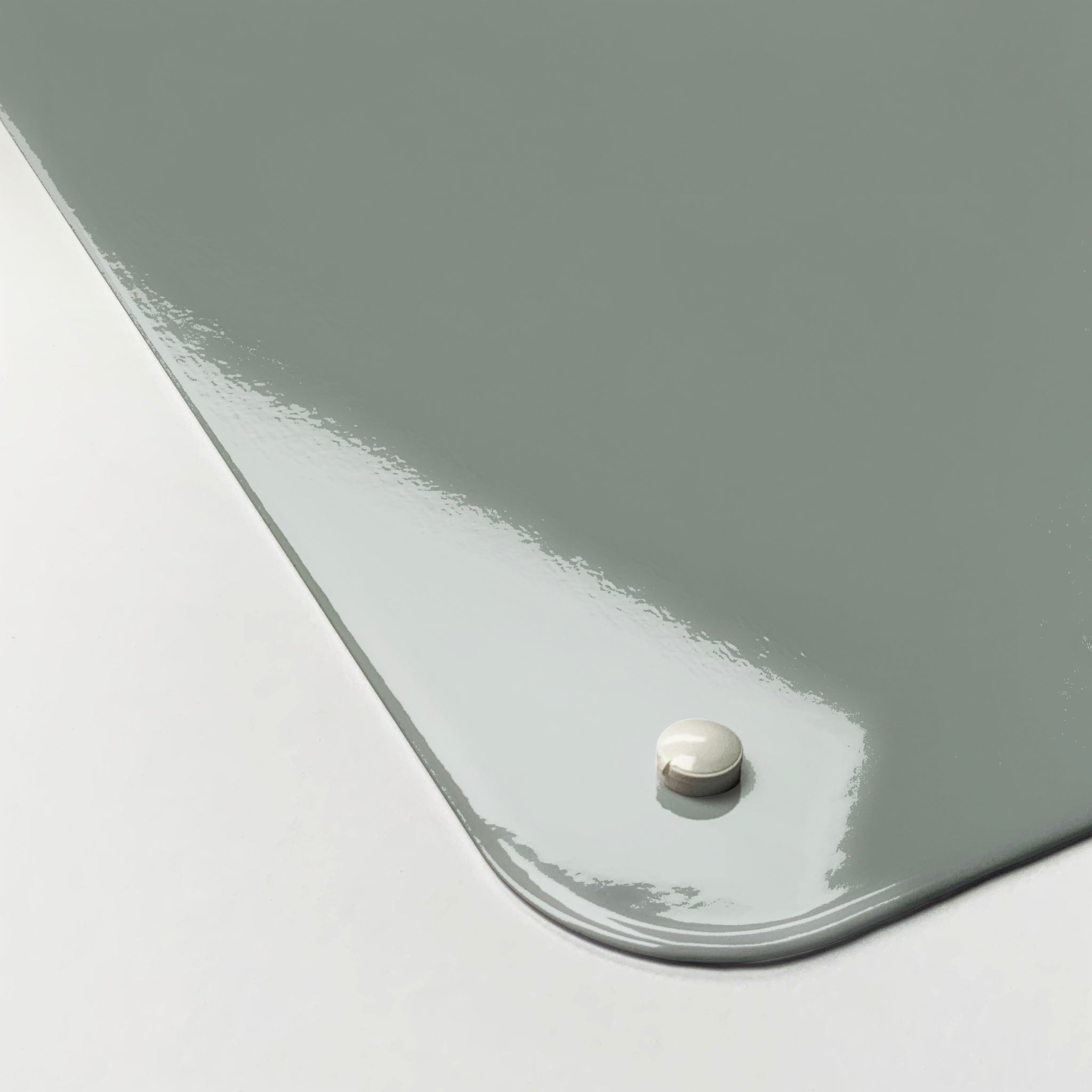 The corner detail of a plain grey magnetic board to show it’s high gloss surface