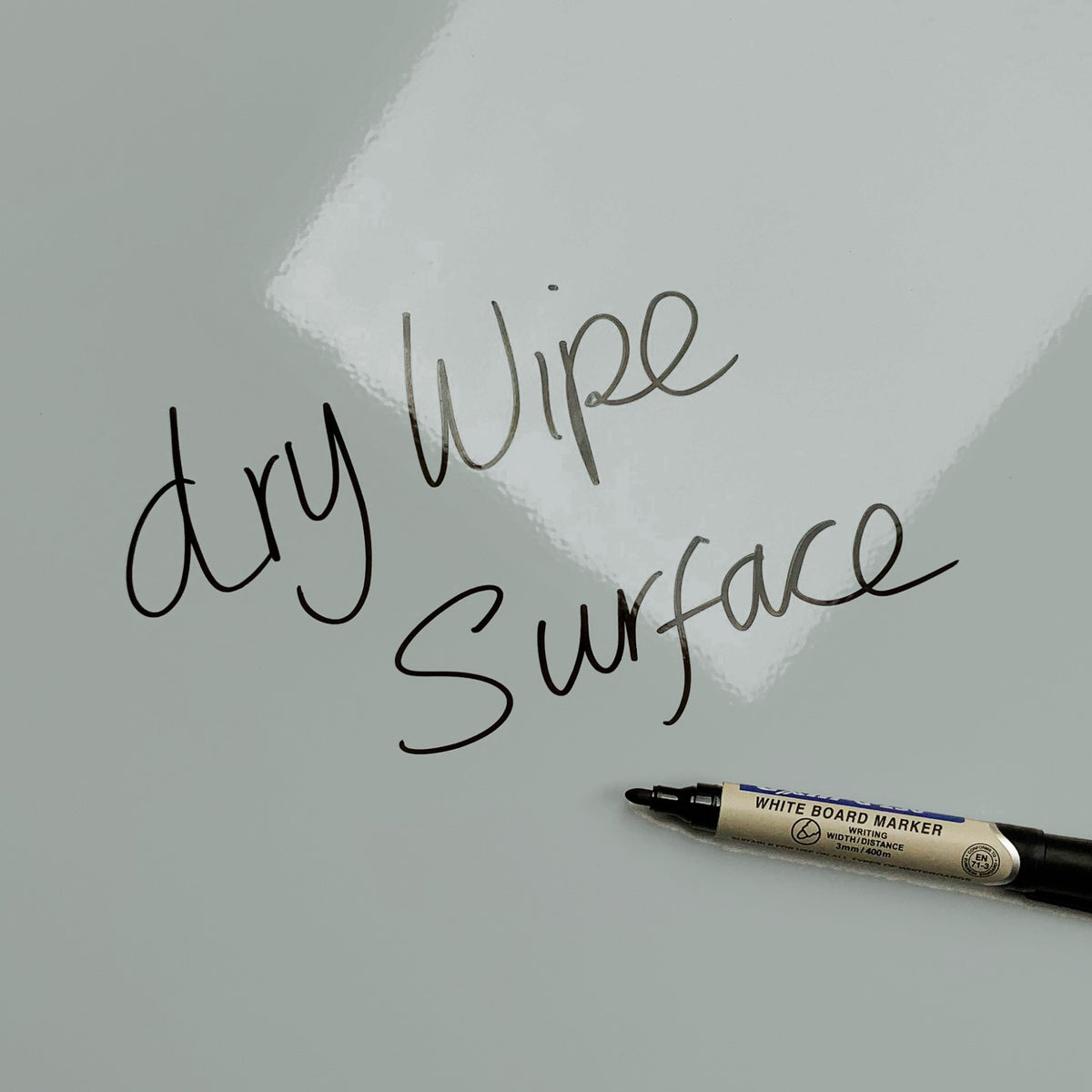 The words dry wipe surface written in marker pen on the Plain Grey magnetic notice board
