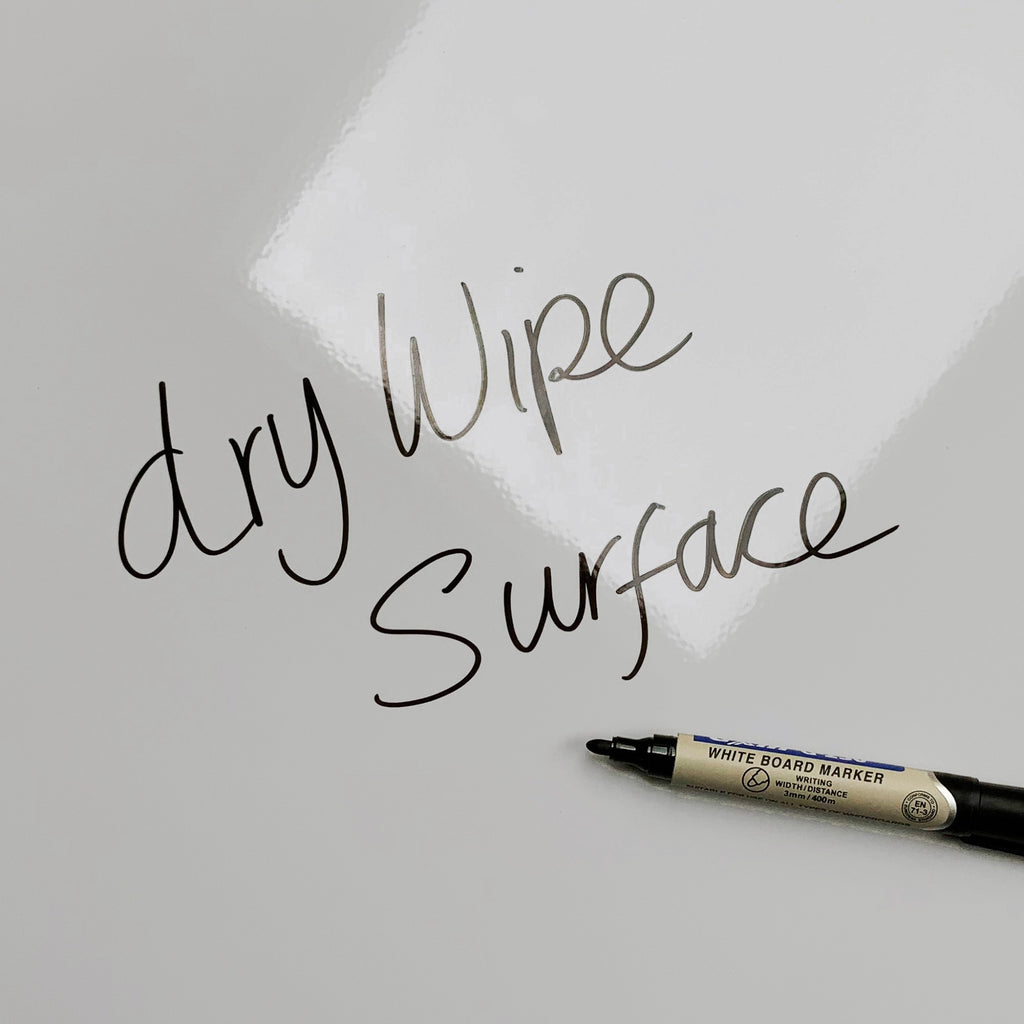 The words dry wipe surface written in marker pen on the Poppy Field magnetic notice board
