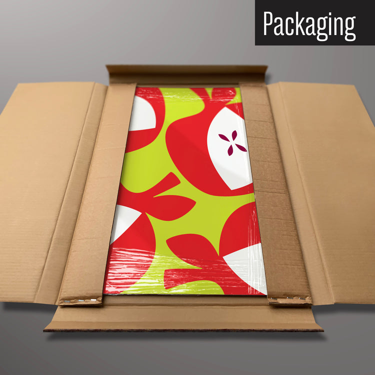 A red apples design magnetic board in it’s cardboard packaging