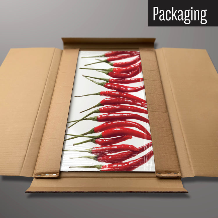 A red chillies magnetic board in it’s cardboard packaging