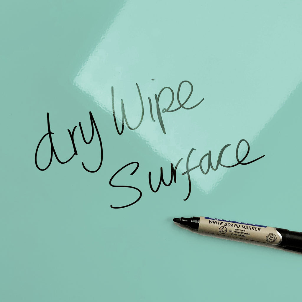 The words dry wipe surface written in marker pen on the Sandcastles magnetic notice board
