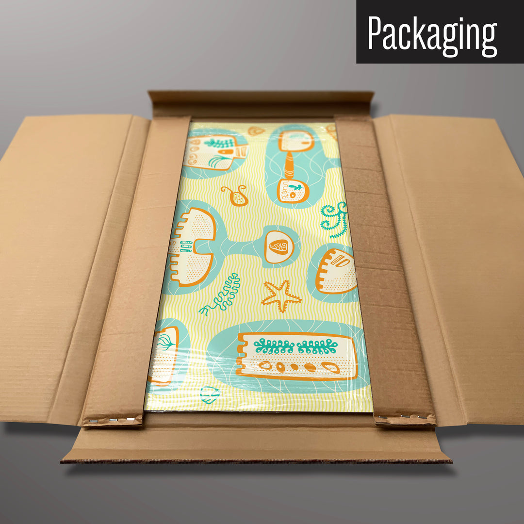 A sandcastles design magnetic board in it’s cardboard packaging