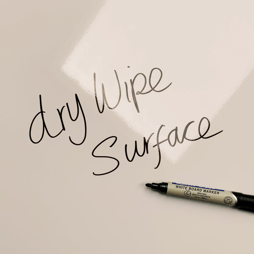 The words dry wipe surface written in marker pen on the Shells Shells magnetic notice board
