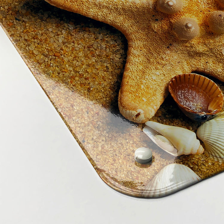 The corner detail of a shoreline shells photographic magnetic board to show it’s high gloss surface
