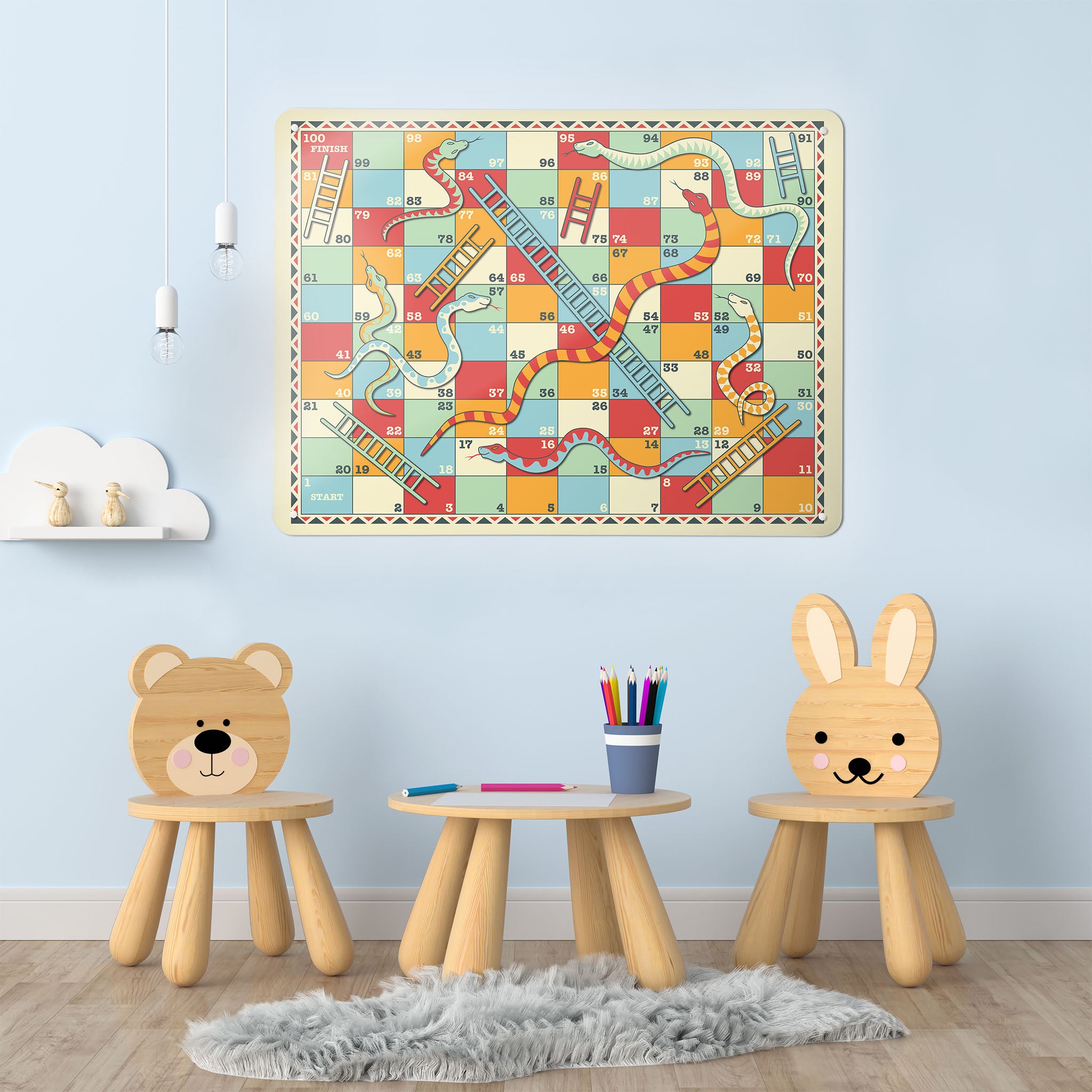 A playroom interior with a magnetic metal wall art panel showing a retro snakes and ladders game design 