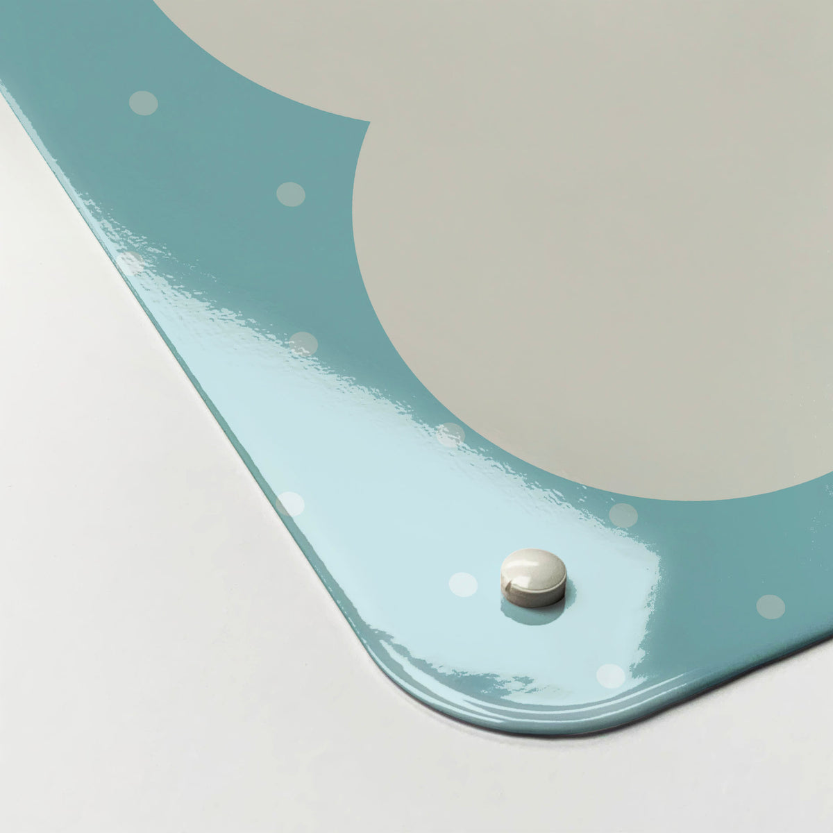 The corner detail of a so much to do blue dry erase magnetic board to show it’s high gloss surface