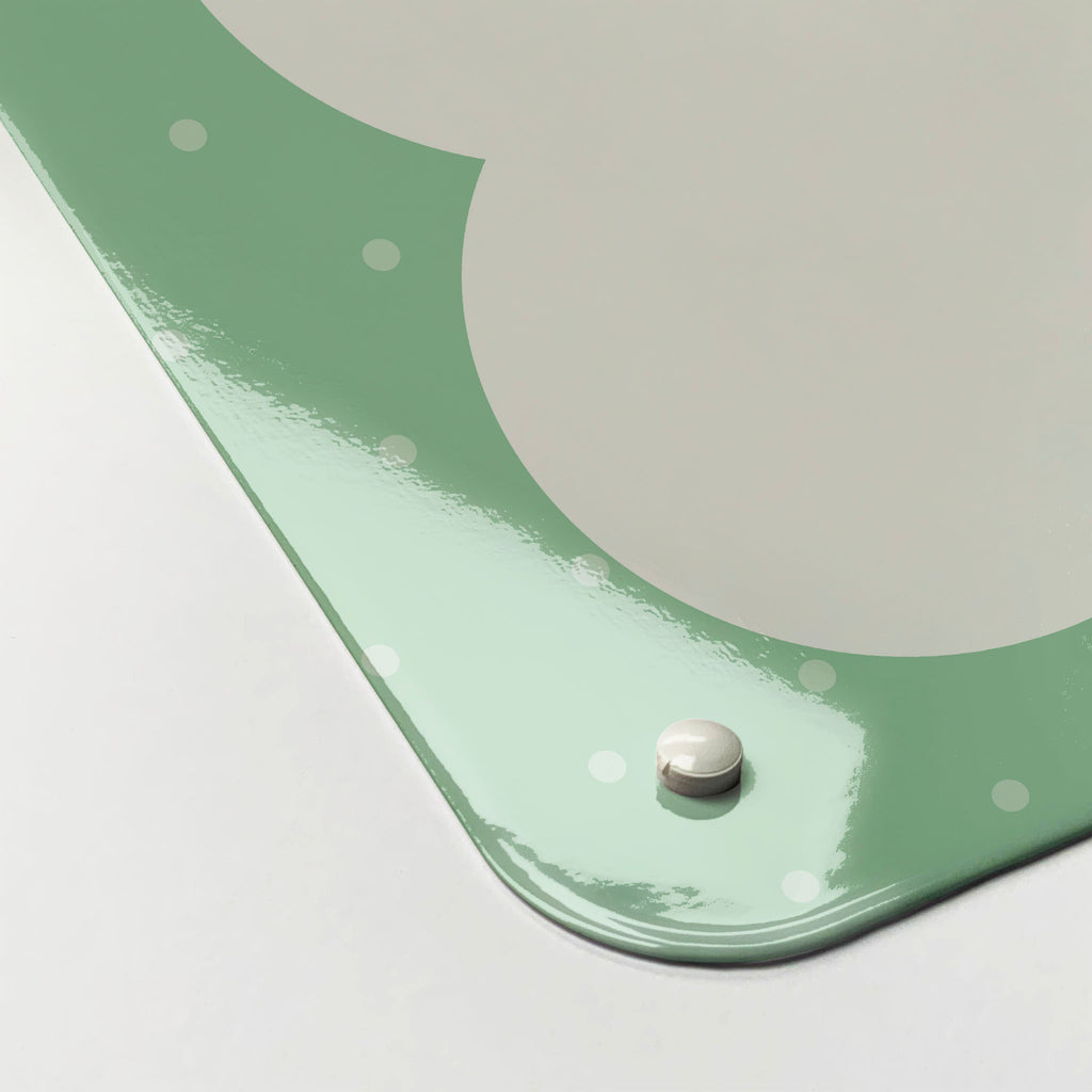 The corner detail of a so much to do green dry erase magnetic board to show it’s high gloss surface