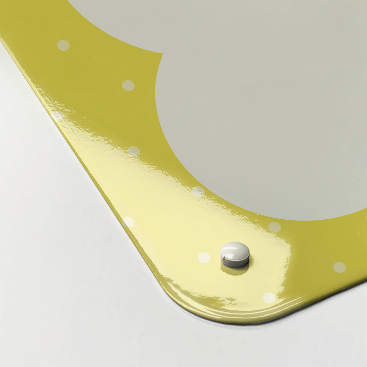 The corner detail of a so much to do yellow dry erase magnetic board to show it’s high gloss surface