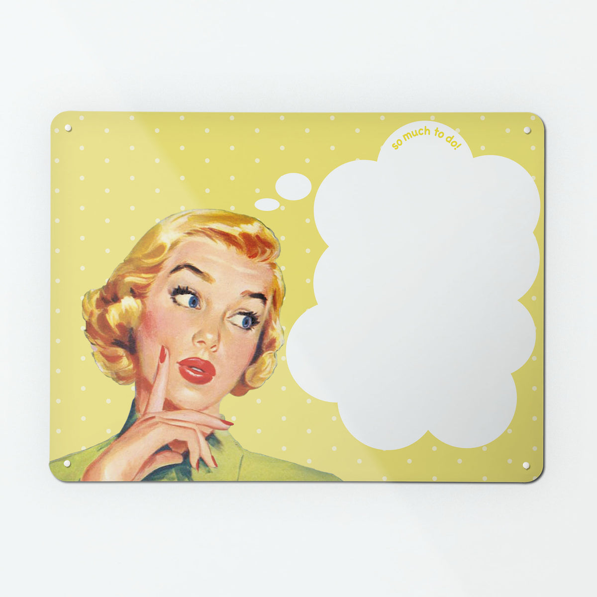 A large dry wipe magnetic notice board by Beyond the Fridge with a vintage girl illustration on yellow polkadot background and white though bubble with 'so much to do' message