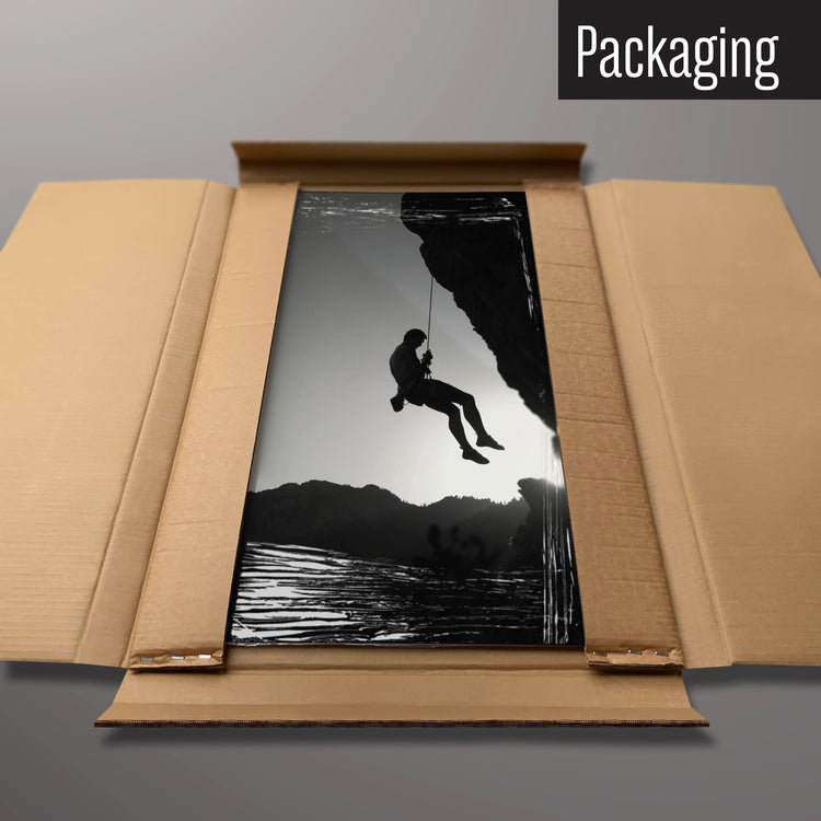 A rock climbing photographic magnetic board in it’s cardboard packaging