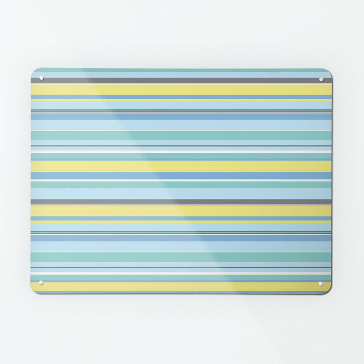 A large magnetic notice board by Beyond the Fridge with a stripes design in beach colour way