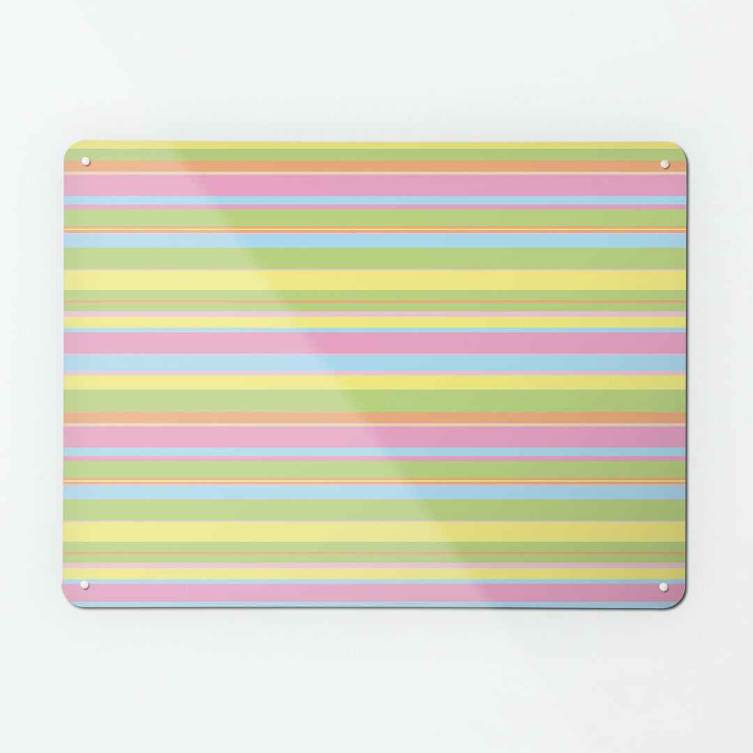 A large magnetic notice board by Beyond the Fridge with a stripes design in candy colour way