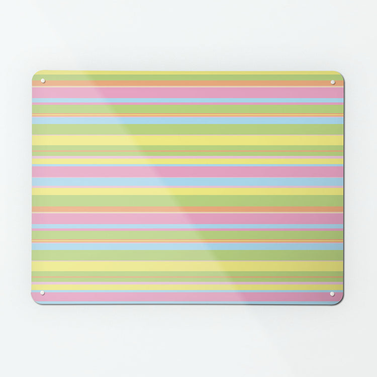 A large magnetic notice board by Beyond the Fridge with a stripes design in candy colour way