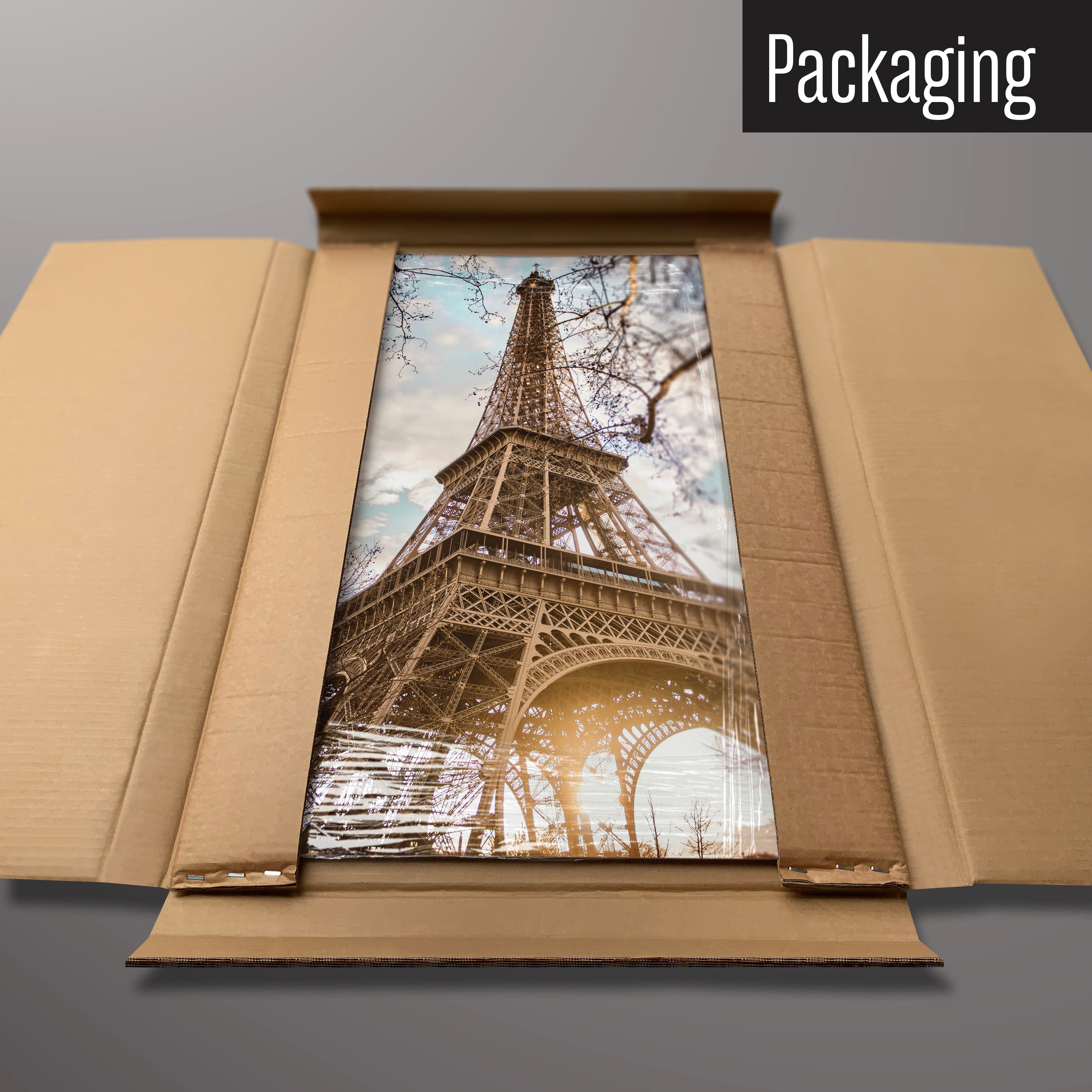 An Eiffel Tower photographic magnetic board in it’s cardboard packaging