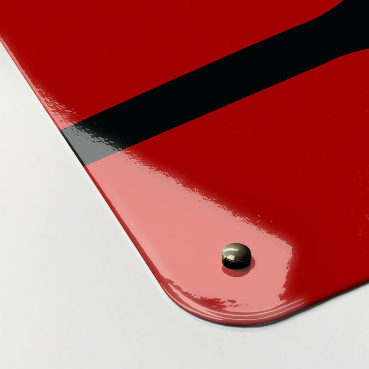 The corner detail of a red utensils design magnetic board to show it’s high gloss surface