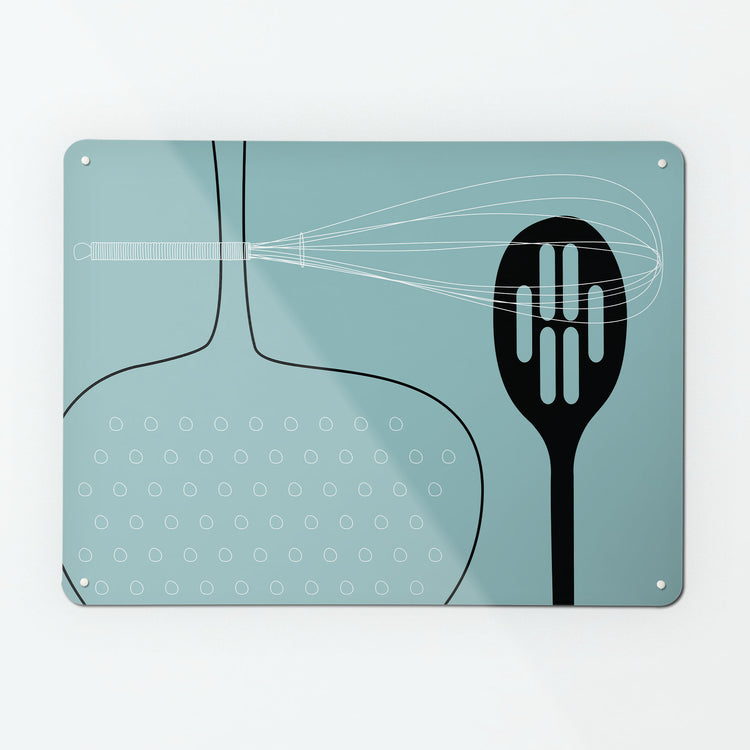 A large magnetic notice board by Beyond the Fridge with a utensils design in blue colour way
