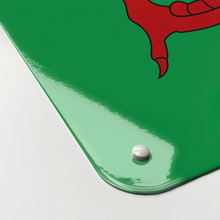 The corner detail of a Welsh flag design magnetic board to show it’s high gloss surface